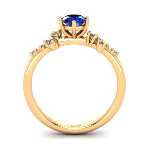 Romantyczny pierścionek zaręczynowy wykonany z żółtego złota z szafirem i brylantami