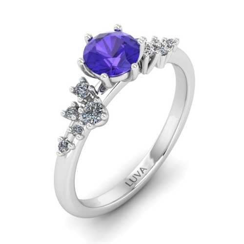 Romantyczny pierścionek z tanzanitem i bocznymi brylantami w białym złocie próby 585